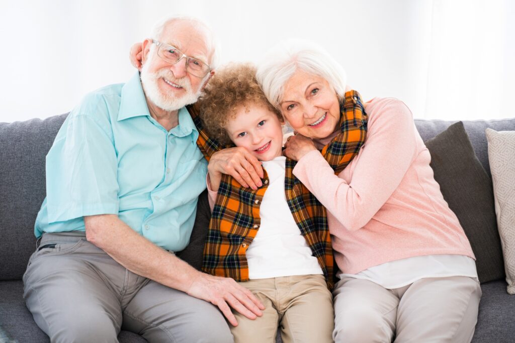 Grandparents and grandson playing at home